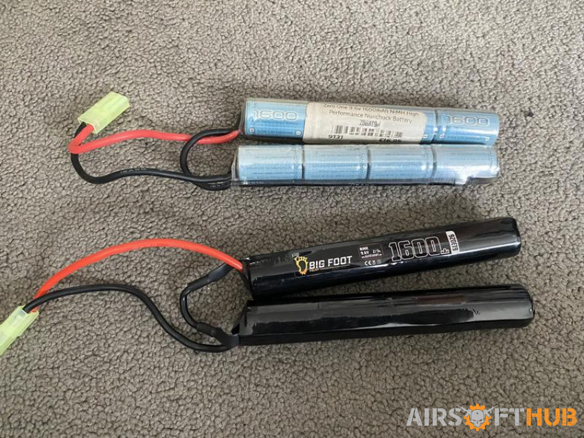 2 Batteries and a Charger - Used airsoft equipment