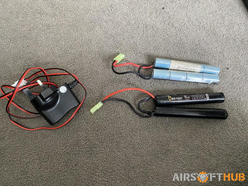 2 Batteries and a Charger - Used airsoft equipment