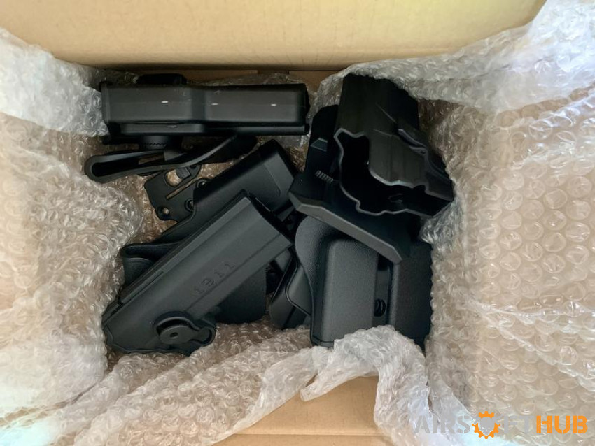 Box of Polymer holsters - Used airsoft equipment