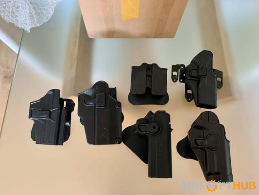 Box of Polymer holsters - Used airsoft equipment