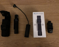 OLIGHT TORCH WITH MOUNT - Used airsoft equipment